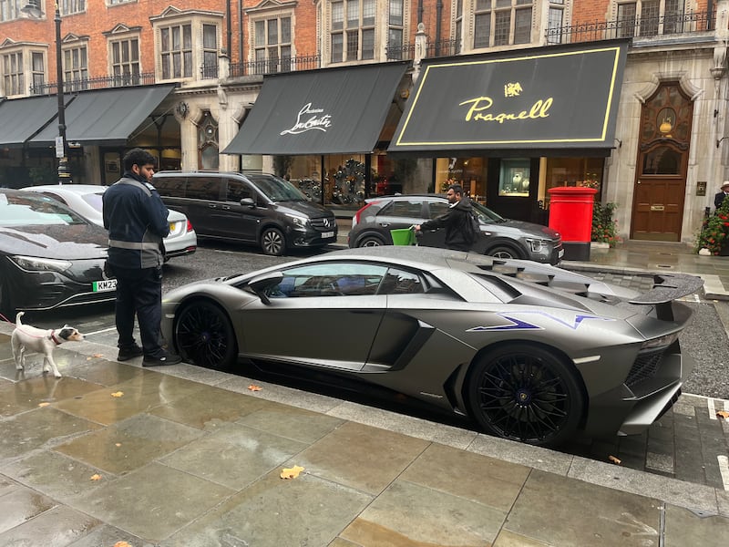 A traffic warden prepares to place a parking ticket on a Lamborghini Aventador parked on Mount Street in Mayfair this week. Photograph: Mark Paul
