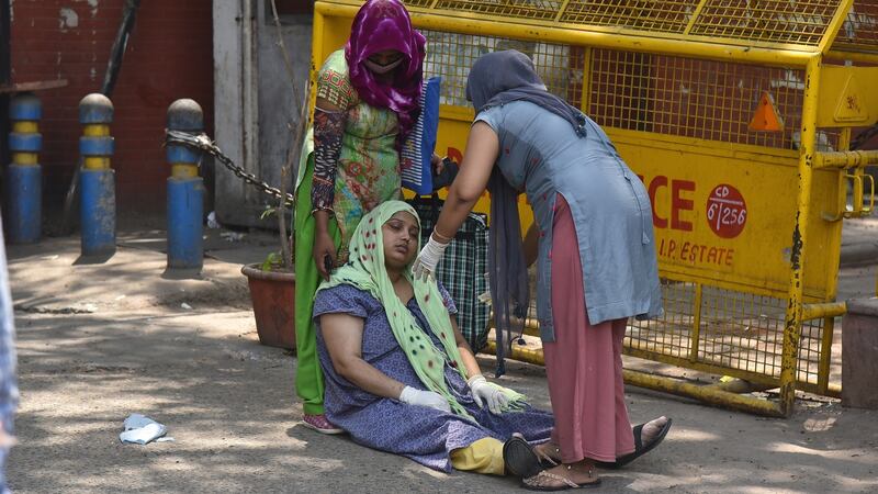 A suspected Covid-19 patient waits for treatment outside of the Covid-19 hospital in New Delhi, India. Photograph: Idrees Mohammed/EPA