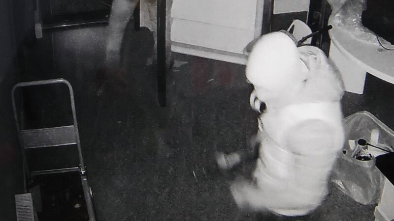 The raiders are seen inside the building trying to disable an alarm.  Photograph Liam Burke/Press 22