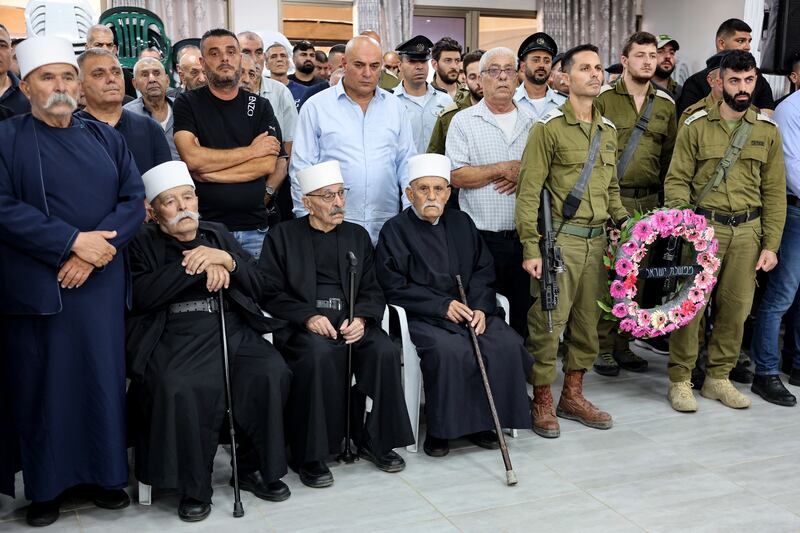 Members of Israel's Druze community attend the funeral of reservist major Nael Fwarsy, killed a day earlier near the northern border with Lebanon, in the northern village of Maghar on Friday, amid near-daily clashes with Hizbullah. Photograph: Jack Guez/AFP via Getty Images