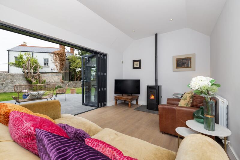 Living space off the kitchen opens to the garden