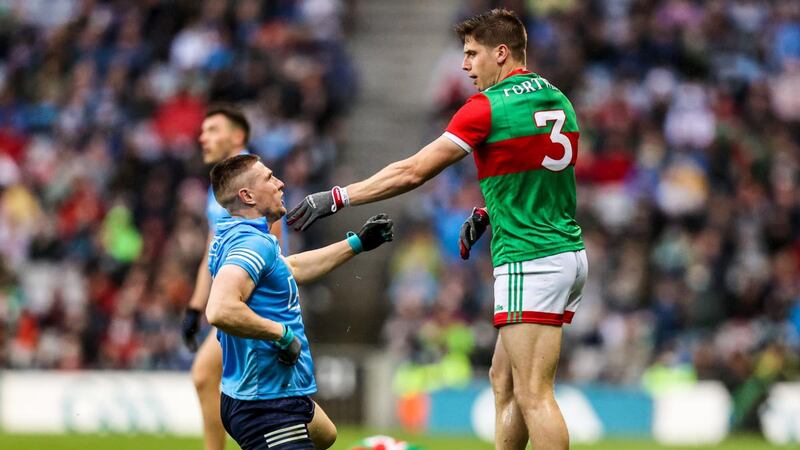 Dublin’s John Small with Lee Keegan of Mayo. Photograph:  Tommy Dickson / Inpho