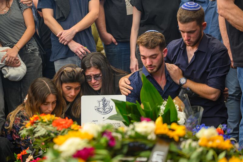 Family and friends grieve for first sergeant major Gal Meir Eisenkot - son of the cabinet minister and former army chief Gadi Eisenkot -  during his funeral in the Herzliya cemetery on December 8th.  Photograph:  Alexi J Rosenfeld/Getty Images