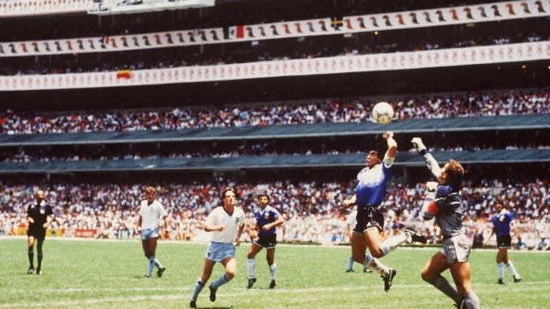Diego Maradona scores his infamous ‘Hand of God’ goal against England at the 1986 World Cup. Photograph: Getty
