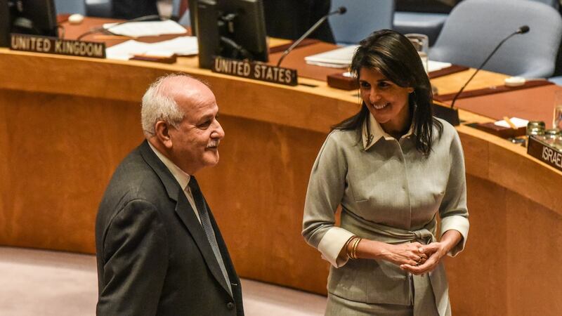US Ambassador to the United Nations Nikki Haley speaks with Palestinian Ambassador to the United Nations Dr Riyad H Mansour during a security council meeting in New York City. Photograph: Stephanie Keith/Getty Images