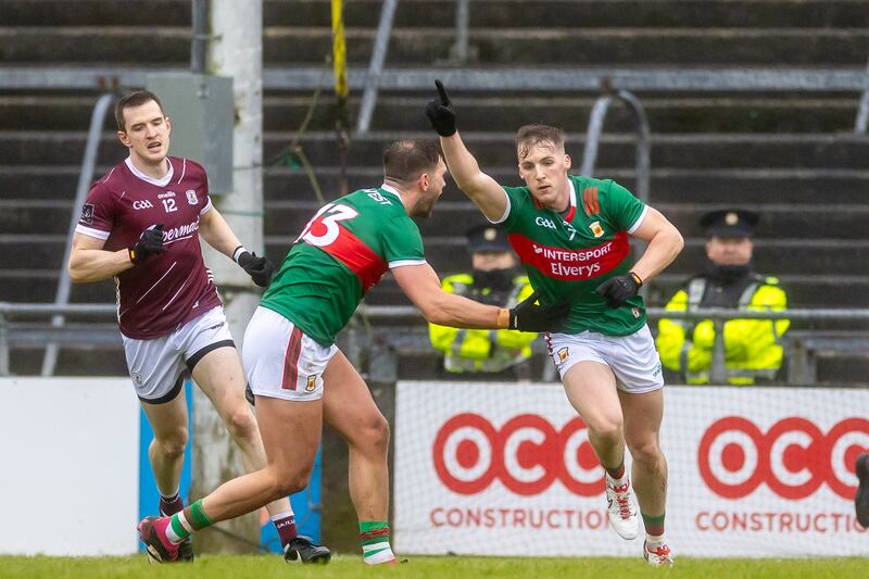 Mayo's Eoghan McLaughlin is congratulated by Aidan O’Shea after scoing a goal against Galway at Pearse Stadium. Photograph: Morgan Treacy/Inpho