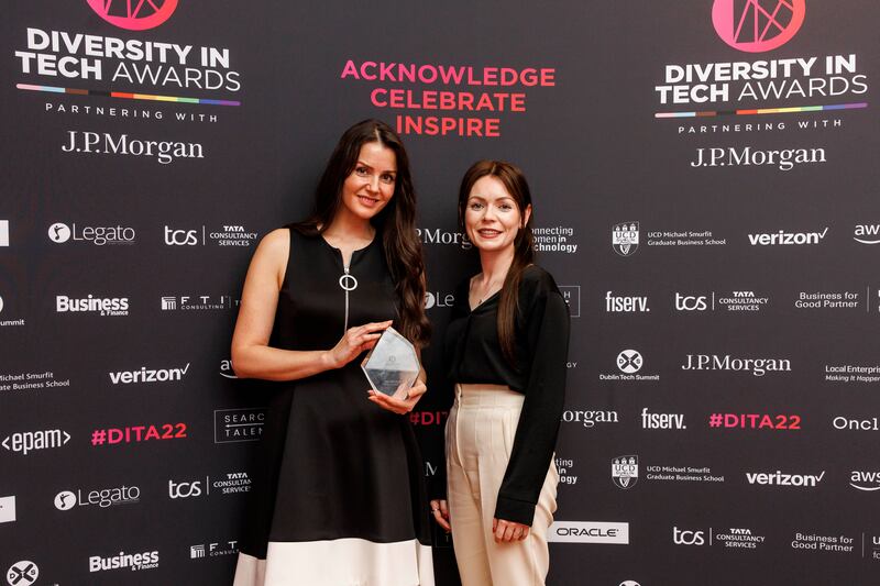 Dr Nora Khaldi from Nuritas collecting the Grace Hopper Award. Presented by Jeanne Reynolds, AWS in Communities