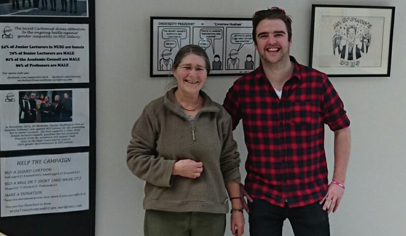 Micheline Sheehy-Skeffington and Galway Students’ Union president Phelim Kelly in front of the Secret Cartoonist exhibition before its removal at NUI Galway. Photograph: Michelinesthreeconditions.wordpress.com