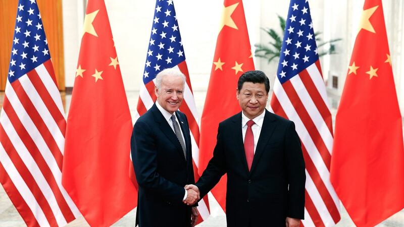China’s resident Xi Jinping shakes hands with then US vice-president Joe Biden in the Great Hall of the People in Beijing in  2013. Photograph: Lintao Zhang/EPA