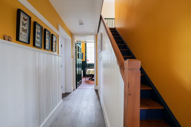 The hall is panelled with yellow overhead