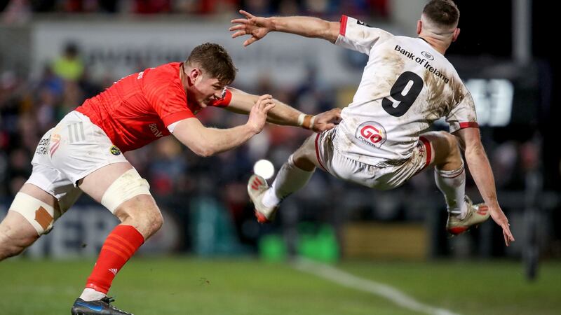 Munster’s Jack O’Donoghue and Ulster’s John Cooney in action during the Guinness Pro 14 game at the   Kingspan stadium in  Belfast. Photograph: Dan Sheridan/Inpho