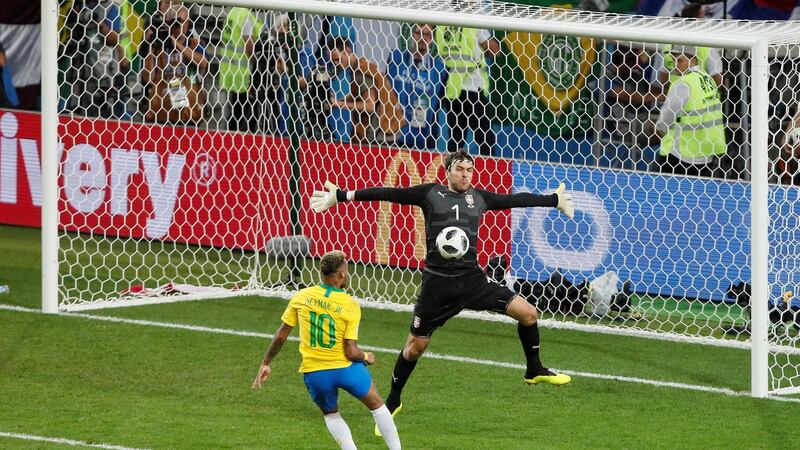 Serbia’s Vladimir Stojkovic makes a save from Neymar. Photo: Maxim Shemetov/Reuters
