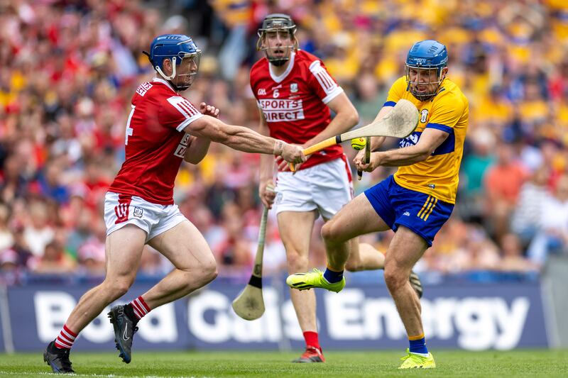 Cork’s Sean O'Donoghue and Robert Downey with Shane O'Donnell of Clare. Photograph: Morgan Treacy/Inpho