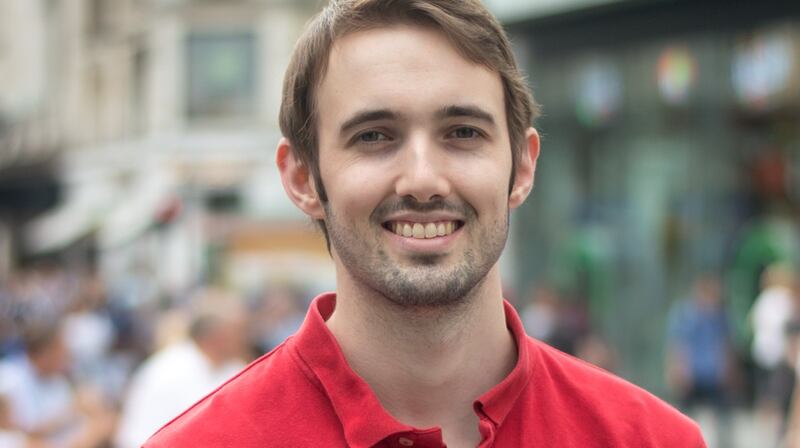 Conor Lane enjoying the sun in Leicester Square, four months after surgery. Photo: Elisa Brugger