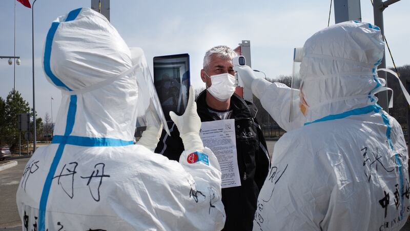 A driver has his temperature checked at a customs checkpoint on the China-Russia border at Suifenhe, in China’s northeast Heilongjiang province. Photograph: Getty