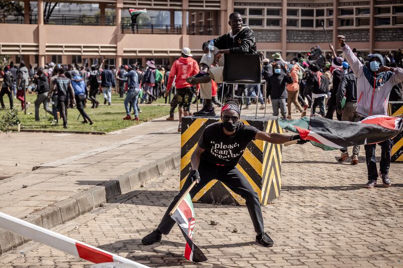 Protesters chant anti-government slogans inside the Kenyan parliament compound on Tuesday. Photograph: Luis Tato/AFP via Getty Images