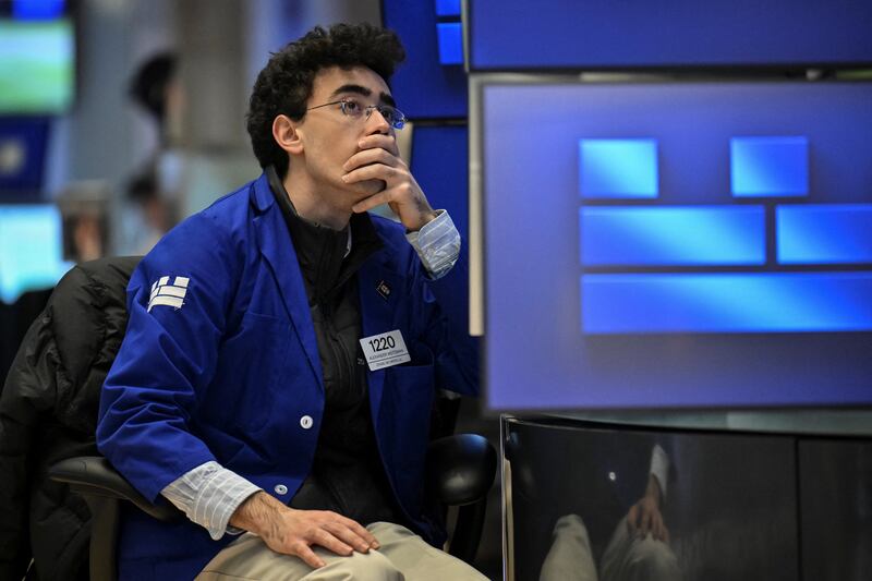 A trader on the floor of the New York Stock Exchange      