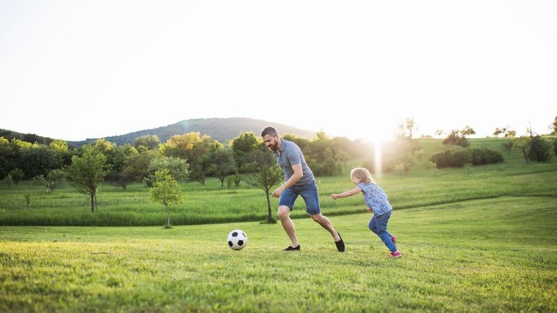 Bringing a football to the park is a simple way to get out of the house and exercise. Photograph: iStock