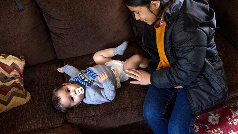 Honduran immigrant Nani, 10, plays with her baby cousin Santiago (nine months) after moving in with her extended family on April 25th, 2021 in Sellersburg, Indiana. Photograph:  John Moore/Getty Images