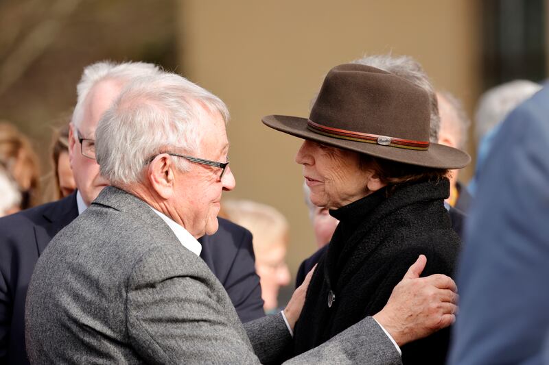 Journalist Olivia O’Leary embraces Kevin Healy, husband of Deirdre Purcell, after the funeral Mass. Photograph: Alan Betson/The Irish Times

