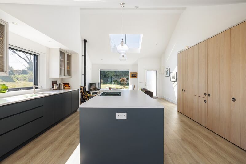 A streamlined kitchen lies in the centre of the house