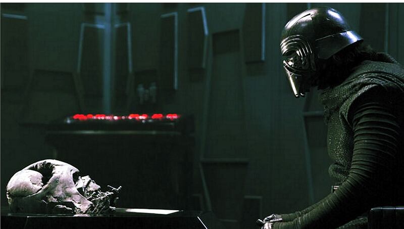 Dark ambition: Kylo Ren (Adam Driver) contemplates the late Darth Vader in Star Wars: The Force Awakens