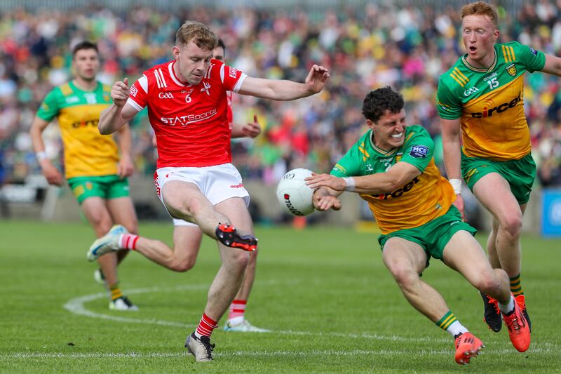 Donegal's Finnbarr Roarty blocks a shot from Louth's Peter Lynch. Photograph: Lorcan Doherty/Inpho