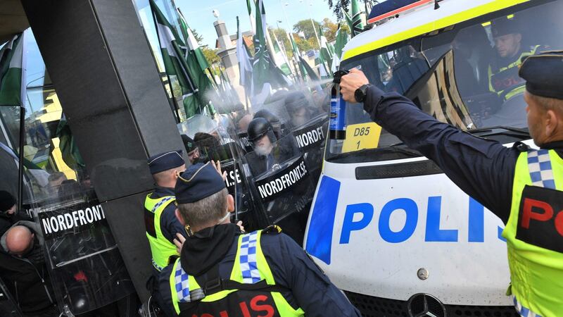 Police  use pepper spray to stop  far-right Nordic Resistance Movement marchers trying to change from the planned route,  in Gothenburg, Sweden. Photograph: Fredrik Sandberg/AFP/Getty Images