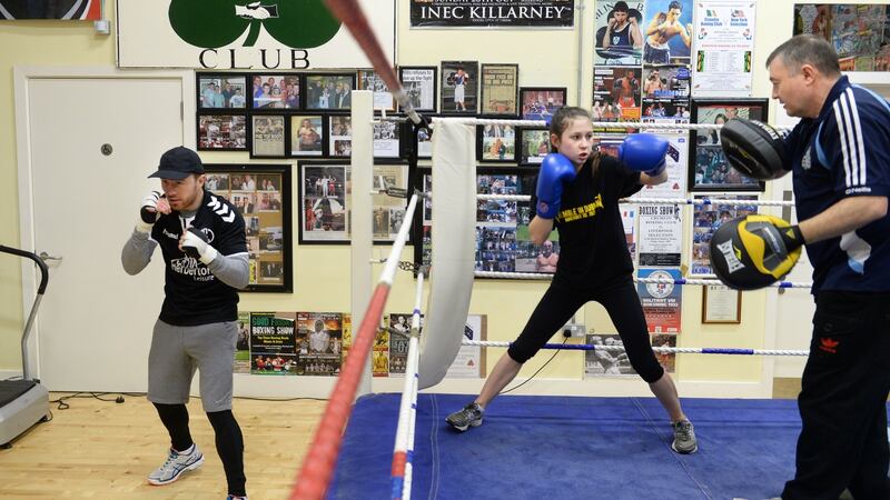 Courtney Daly, with coach Phil Sutcliffe and his son Phil Junior, at Crumlin Boxing Club, Dublin. Photograph: Dara Mac Dónaill/The Irish Times