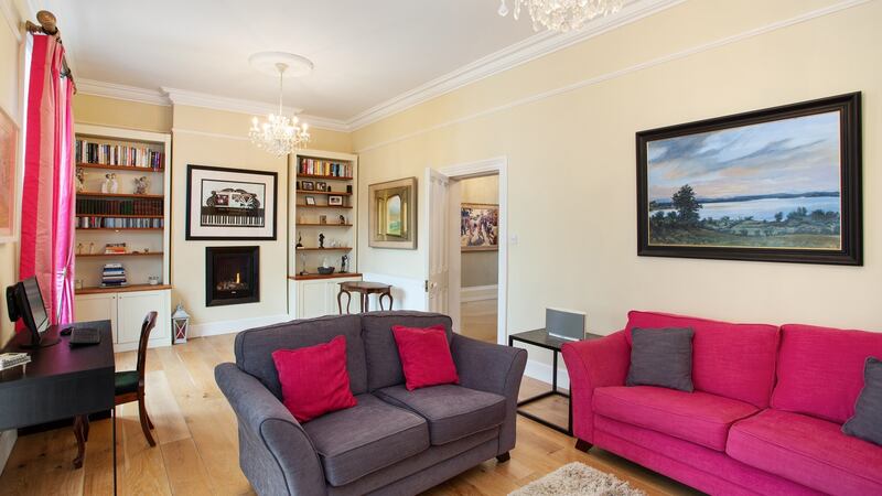 The second livingroom, originally two rooms, with two gas fires, feels both cosy and bright