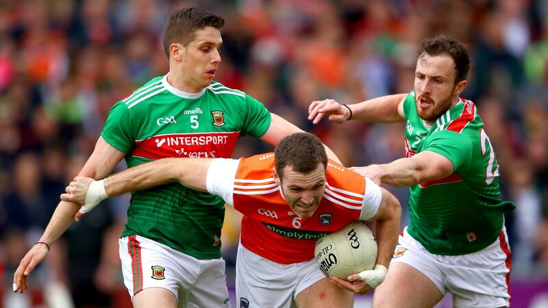 Mayo’s Lee Keegan and Darren Coen Challenge  Brendan Donaghy of Armagh during the All-Ireland SFC round-three qualifier at  Elverys MacHale Park in Castlebar. Photograph: James Crombie/Inpho
