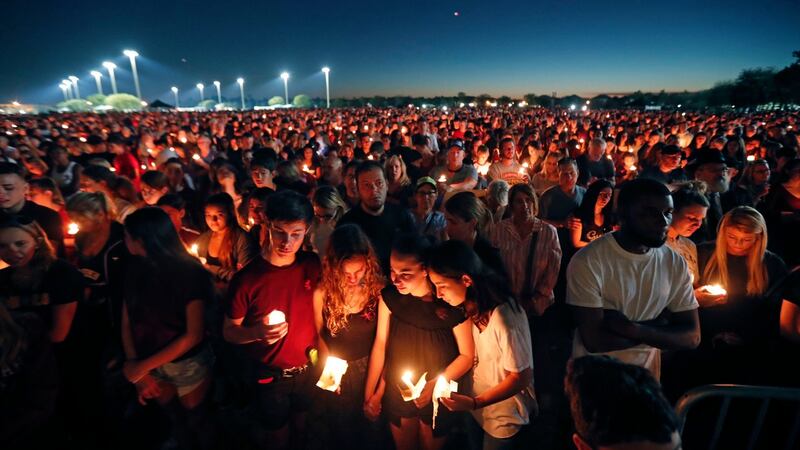 People attend a candlelight vigil at Marjory Stoneman Douglas High School, Florida. Photograph: Gerald Herbert/AP