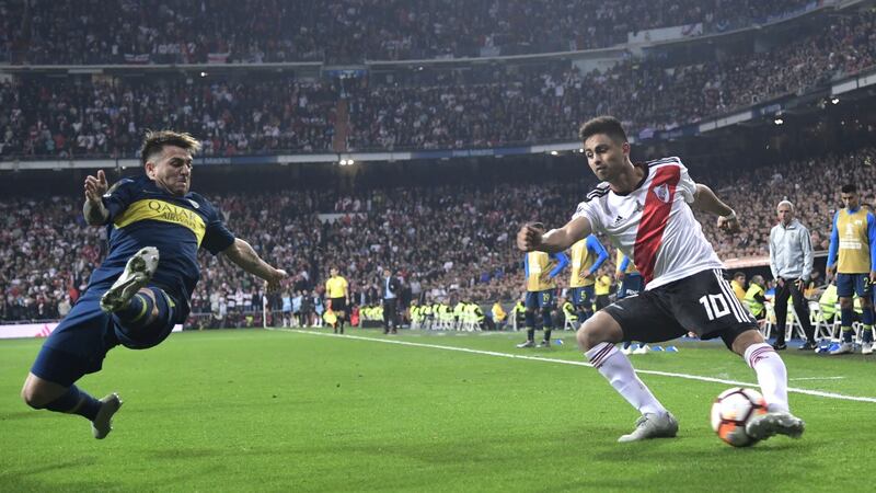 River Plate’s Gonzalo Martinez is challenged by Boca Juniors’ Julio Buffarini. Photo: Javier Soriano/Getty Images
