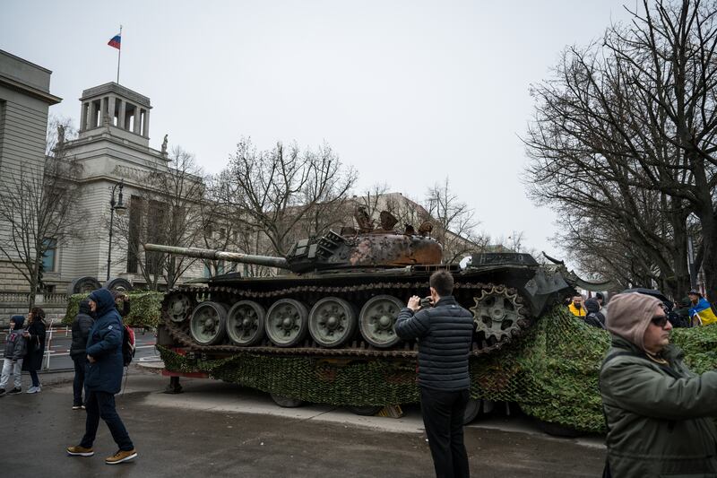 People stand in front of the destroyed Russian tank outside the Russian embassy in Berlin, Germany, to commemorate the first anniversary of Russia's war in Ukraine on February 24th. Photograph: 
