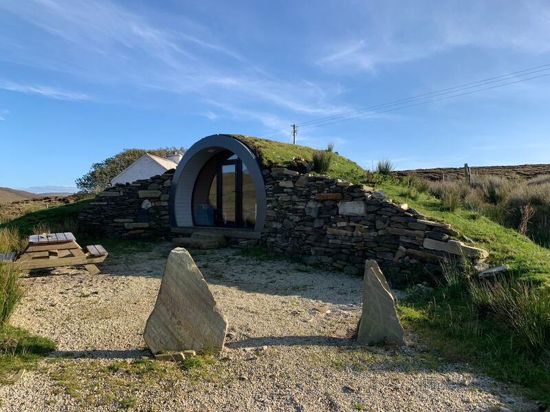 CroPod in Co Donegal is an underground shelter flooded with light, and lined with oak, overlooking a coastal mountain lake