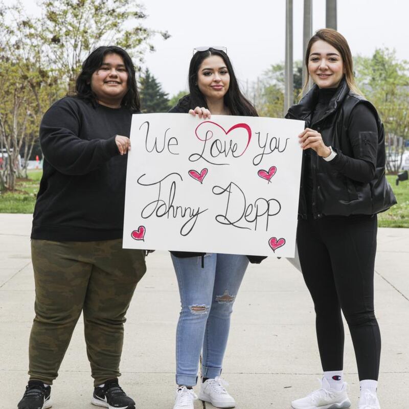 Ines Sorto-Rojas, Kailyn Diaz, and Anasofia Almanac show their support for actor Johnny Depp. Photograph: Valerie Plesch/The New York Times
