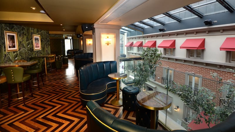 Upstairs bars overlook the glazed roof  ‘street garden’.