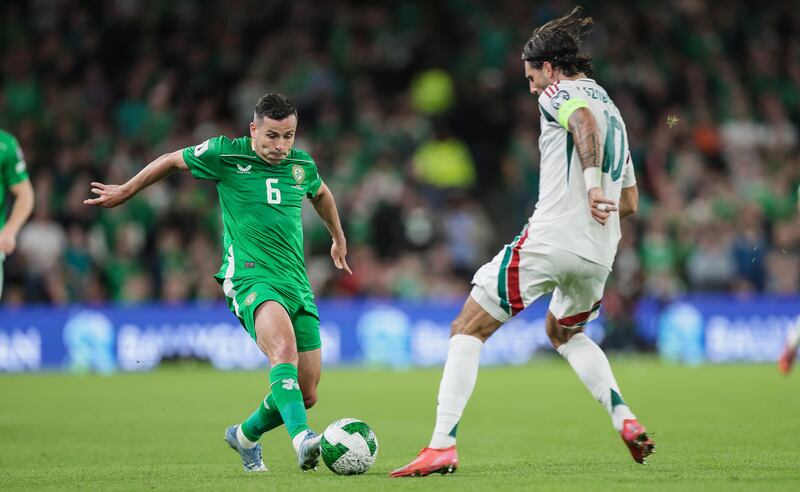 Josh Cullen in action against Hungary's Dominik Szoboszlai. Photograph: Laszlo Geczo/Inpho