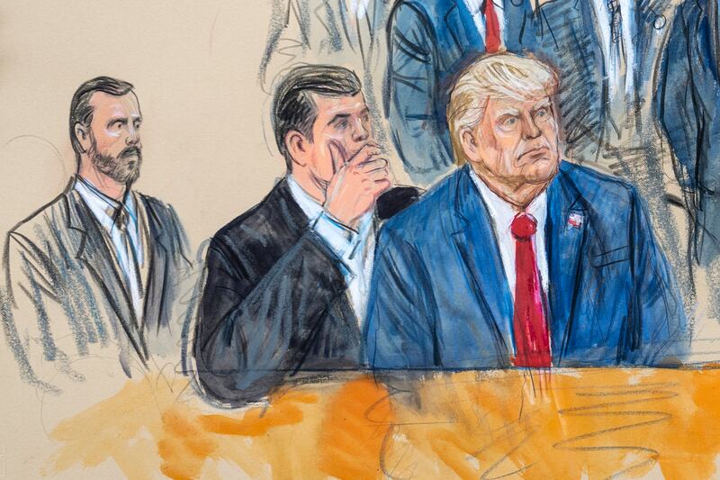 An artist's sketch depicts Donald Trump, right, conferring with defence lawyer Todd Blanche in Washington. Photograph: Dana Verkouteren via AP