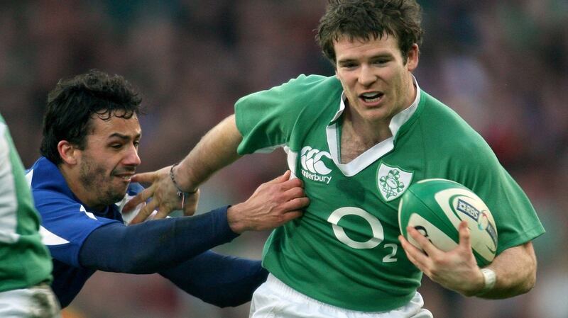 Gordon D’Arcy gets tackled by Clement Poitrenaud during the 2007 Six Nations. Photograph: Billy Stickland/Inpho