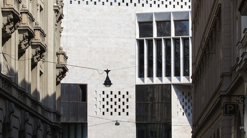 The company’s design knits together several historical buildings and courtyards to create an internal sequence of spaces and routes.