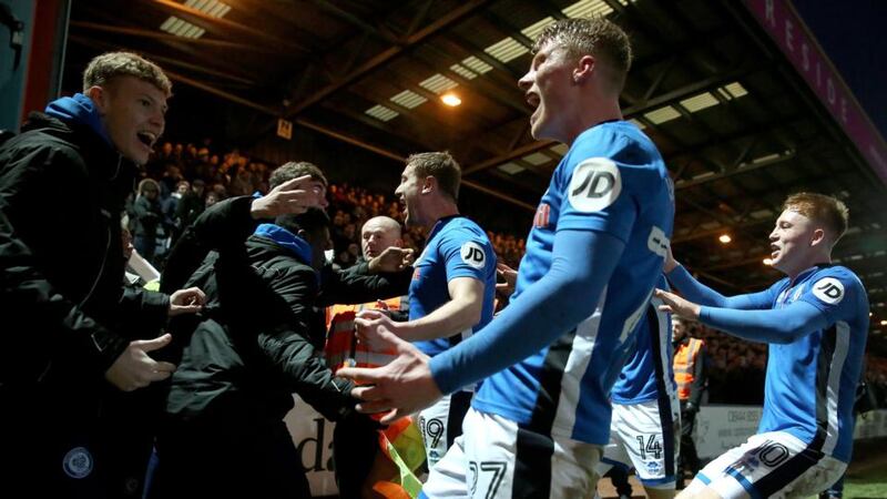Rochdale’s Steve Davies  celebrates with team-mates and fans after scoring his side’s late equaliser. Photograph: Tim Goode/PA Wire