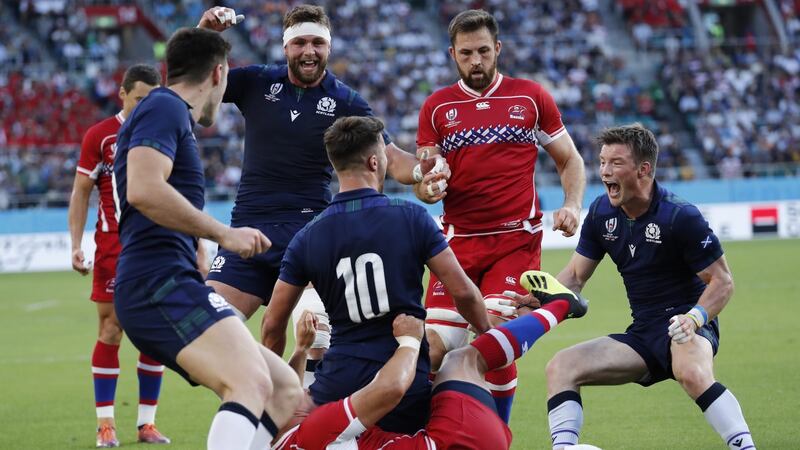 Adam Hastings celebrates with his teammates after scoring a try. Photo: Mark R. Cristino/EPA