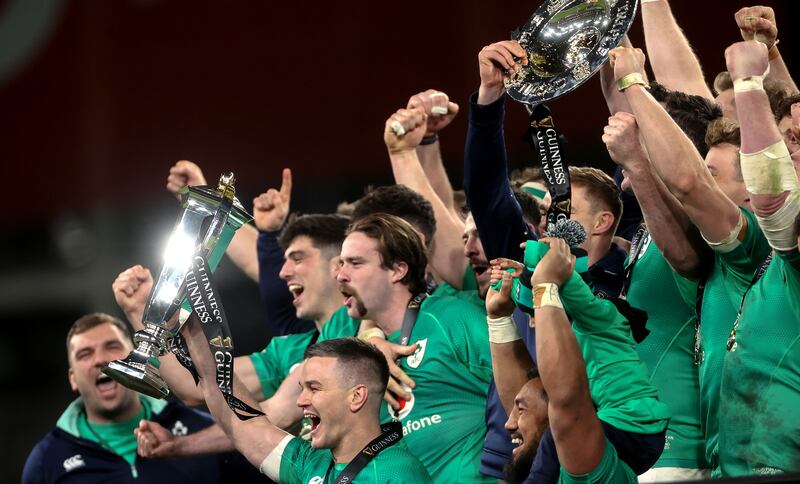 Ireland’s Johnny Sexton lifts the Six Nations trophy as the team celebrate after the win over England. Photograph: James Crombie/Inpho