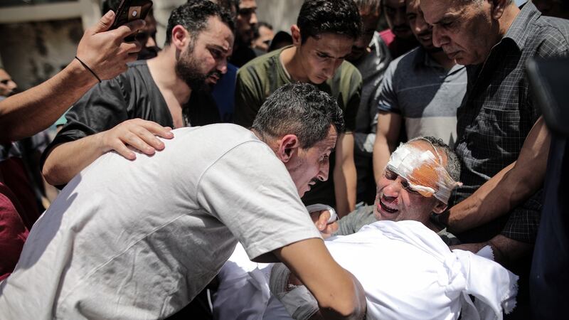 Raed Ishkontana, who survived an Israeli air strike, mourns the loss of five family members including four children  in Gaza City on May 16th. Photograph: Hosam Salem/New York Times
