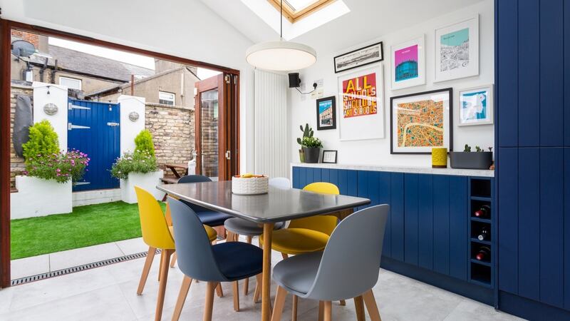 Dining area and fold-back doors leading to rear garden