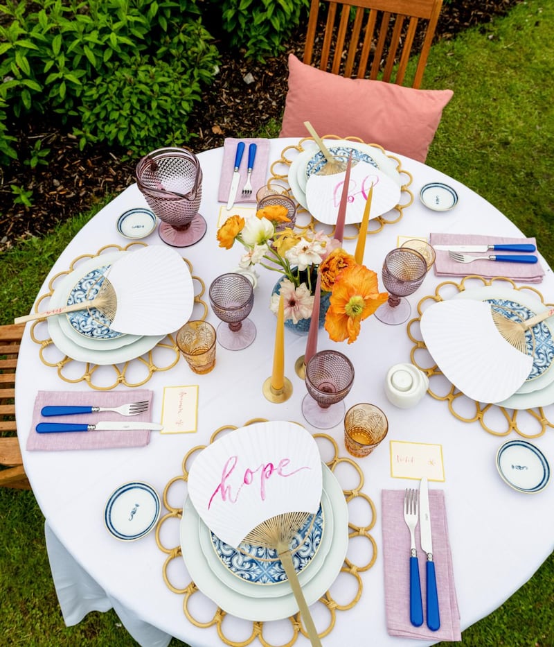 Dress table in style with individual place settings, napkins and cutlery