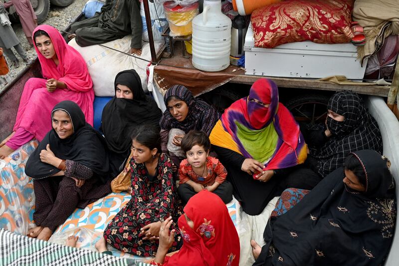 Afghan refugees arrive with their belongings on trucks from Pakistan at the border. Photograph: Wakil Kohsar/AFP/Getty