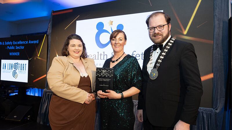 Jennifer Lee, awards judge, presents the health & safety excellence award – public sector to Colm Murray & Amanda Cullen, Longford County Council