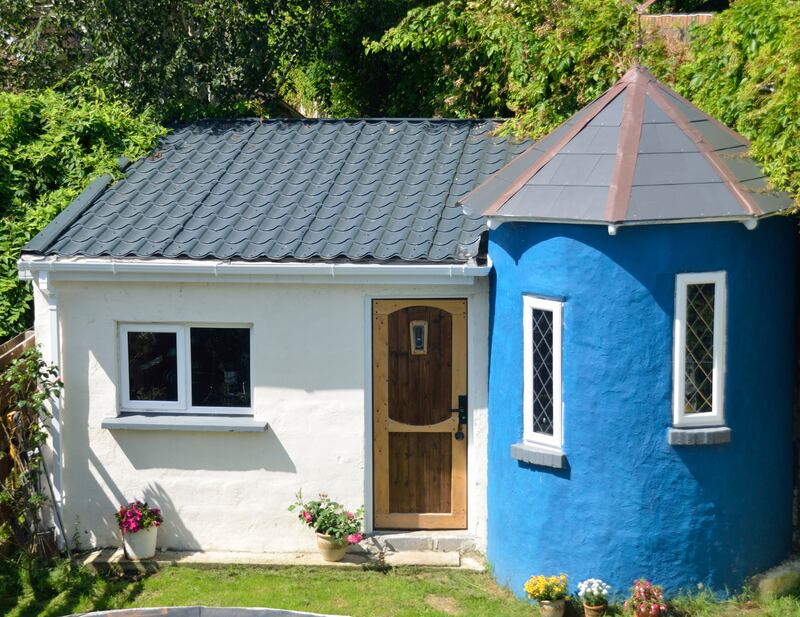 Pat O’Duffy, from Limerick, built his shed with a turret, to take the eye off his wall